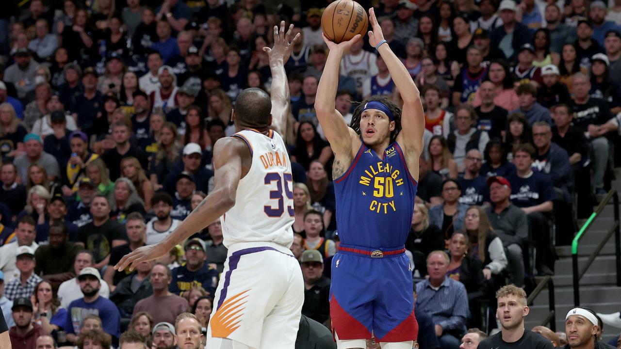 Aaron Gordon of the Denver Nuggets puts up a shot against Kevin Durant of the Phoenix Suns. Photo by Matthew Stockman/Getty Images