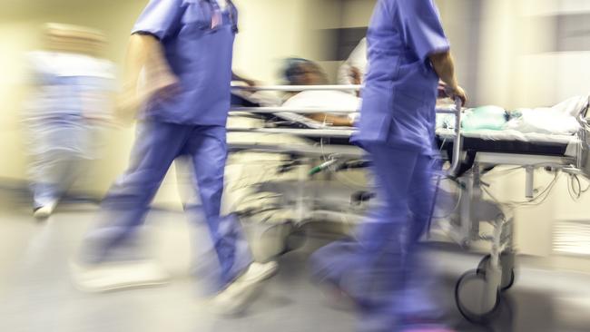 Doctors and nurses rushing with hospital trolley. Picture: iStock