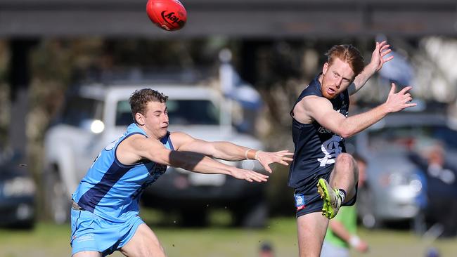 South Adelaide’s Nick Liddle gets a kick away against Sturt.