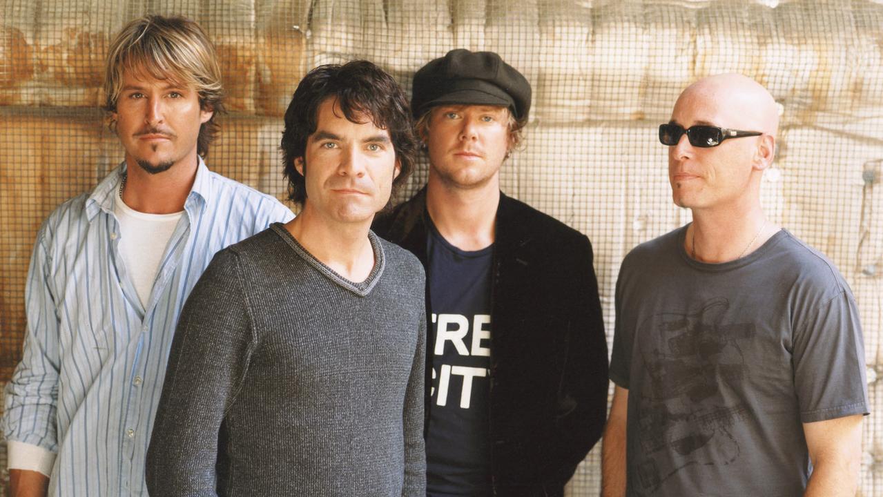 Colin (far left) with the members of Train, including lead singer Pat Monahan (second from left).