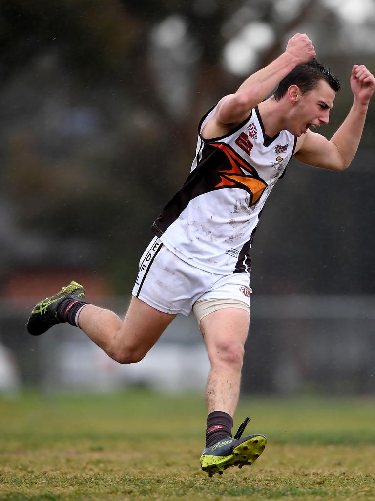 Anthony Righele celebrates a valuable goal in the rain. Picture: Andy Brownbill