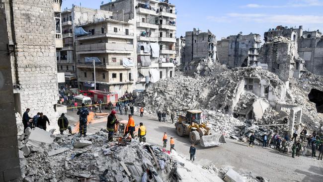 Syrian civil defence workers search the rubble of a collapsed five-storey building in the Salah al-Din district of the northern city of Aleppo. Picture: AFP