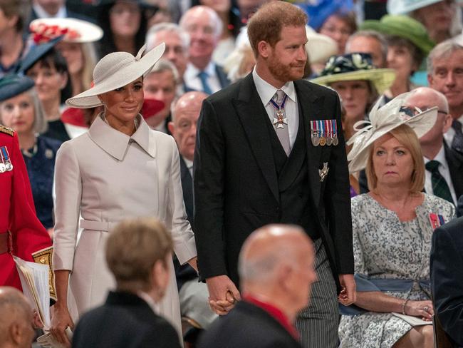 All eyes were on Prince Harry and Meghan Markle as they arrived at a thanksgiving service for the Queen. Picture: AFP