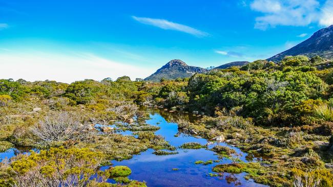 Beautiful rugged scenery with glacial lakes and alpine heath on remote mountain plateau at Hartz Mountains National Park, Tasmania, Source: istock