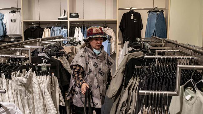 A woman shops inside a H&amp;M store in Beijing on Thursday. Picture: AFP