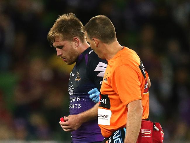 Cameron Munster leaves the field with a broken jaw. Picture: Wayne Ludbey