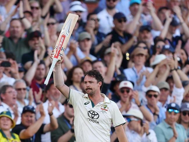 ADELAIDE, AUSTRALIA - DECEMBER 07: Travis Head of Australia acknowledges the crowd while leaving the field after being bowled by Mohammed Siraj of India during day two of the Men's Test Match series between Australia and India at Adelaide Oval on December 07, 2024 in Adelaide, Australia. (Photo by Paul Kane/Getty Images)