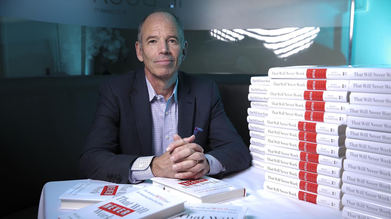 Netflix co-founder Marc Randolph alongside copies of his new book.