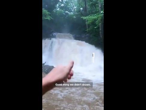 Tourists flee as waterfall becomes a flash flood