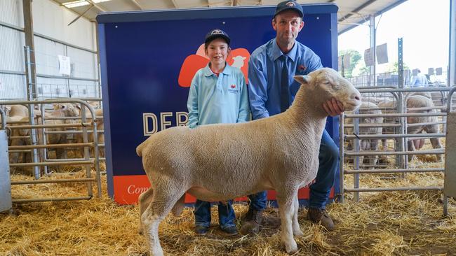 Audrey Beattie, 9, with Simon Beattie and the top-priced Derrynock Poll Dorset ram. Picture: Rachel Simmonds