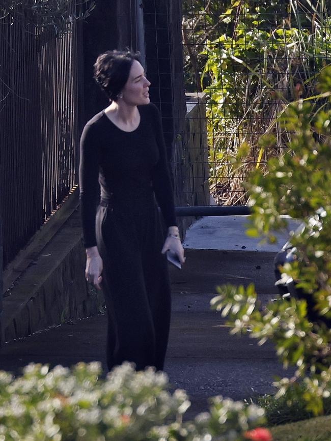 Sarah Budge outside the house on Friday as detectives searched the street. Picture: Sam Ruttyn