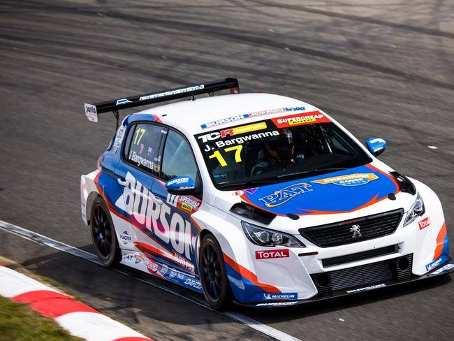 Former Bathurst 1000 champion Jason Bargwanna racing his Peugeot TCR race car at Symmons Plains.