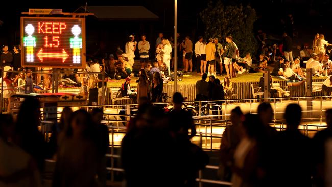 Signs instructing social distancing on the north end of Bondi Beach on Sunday night. Picture: Damian Shaw