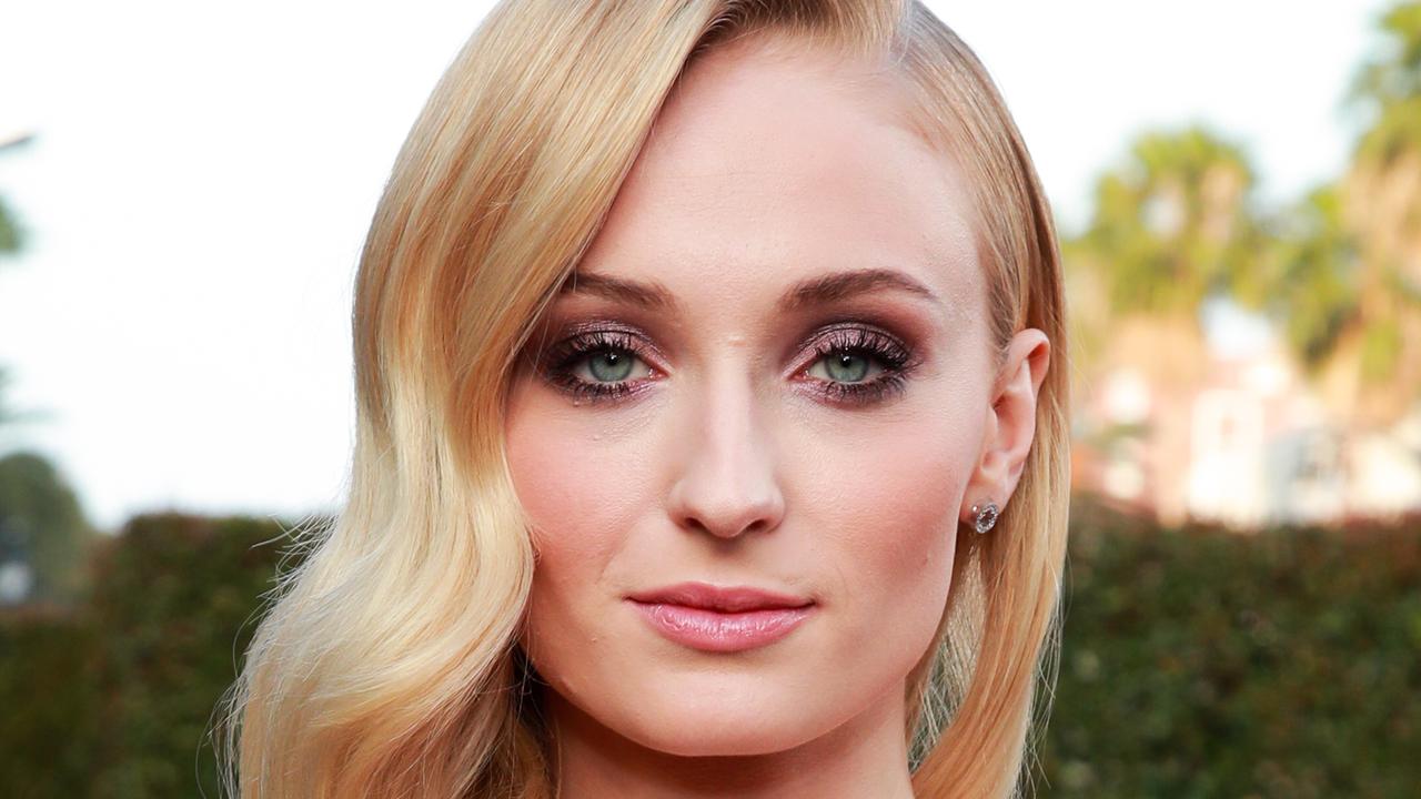 A beauty in lace: Sophie Turner is breathtaking in her custom-made