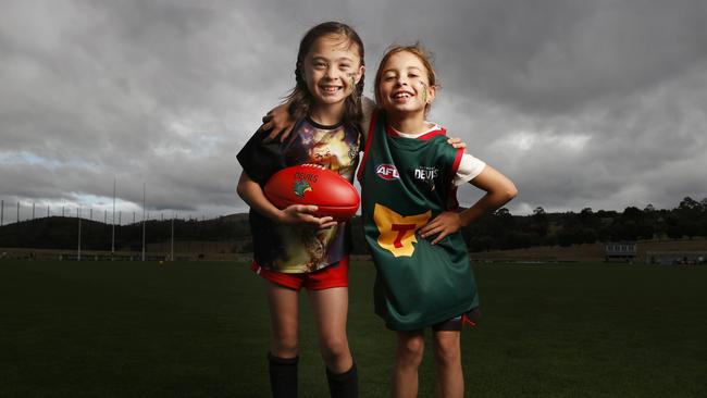 Emma Banks, 9, and Ivy Hickey, 9, play for Clarence Junior Football Club were keen to learn new skills at the clinic. Picture: Nikki Davis-Jones