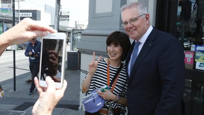 Scott Morrison chats to people on the street during a visit to Malvern. Picture: NCA NewsWire / David Crosling