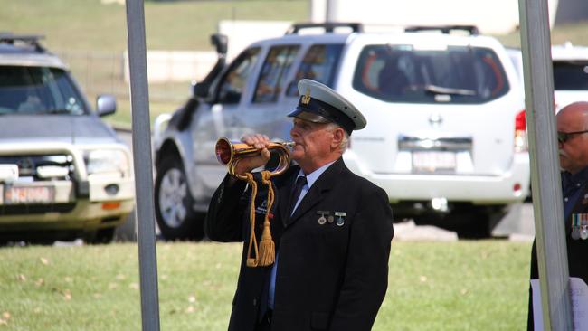 Bugler Trevor Webb plays the Last Post at the 54th anniversary commemoration of the Battle of Long Tan at Gladstone's Anzac Park. Picture Rodney Stevens