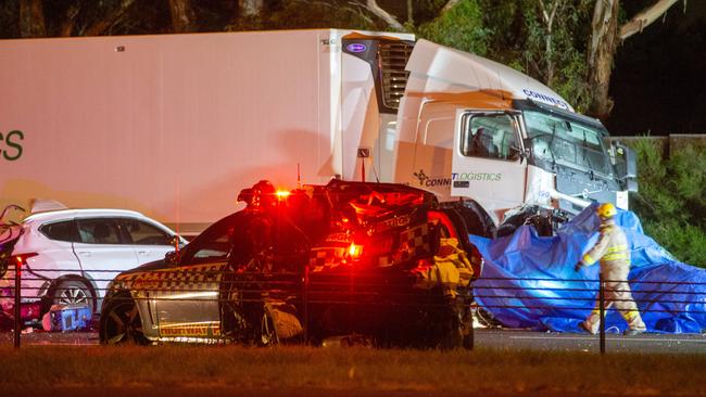 Two police cars, a truck and a Porsche were involved in the collision. Picture: Mark Stewart