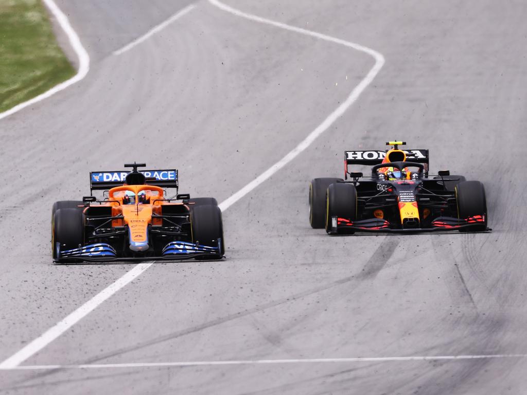 Daniel Ricciardo battling with Sergio Perez.