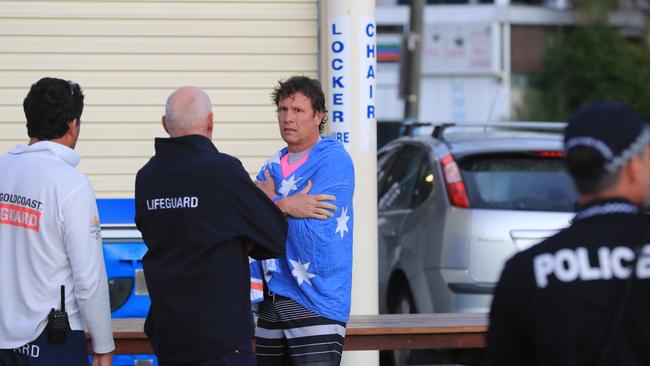 Beachgoers and lifeguards at Greenmount Beach, Coolangatta, after the fatal shark attack.