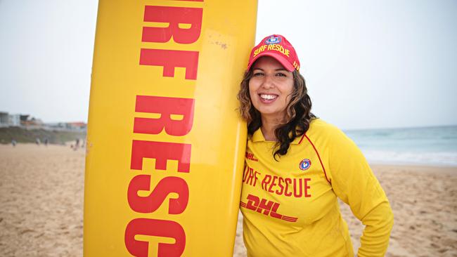 Amy Nosike pauses for a photograph during her volunteer shift at Mereweather beach. Picture: Adam Yip