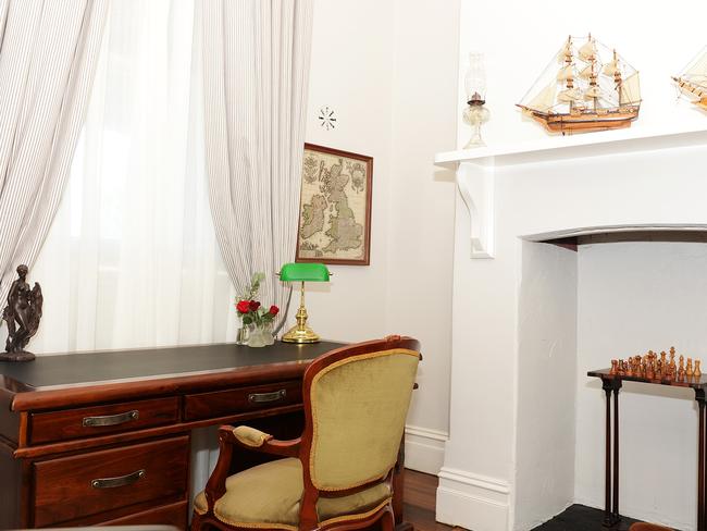 Chess sets and hardwood desks feature in the bedrooms.