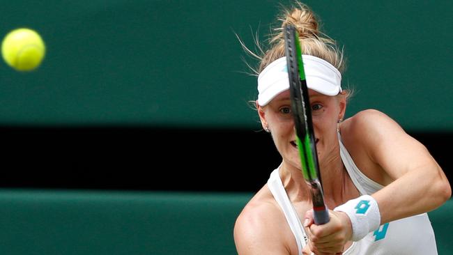 Alison Riske plays a return to Serena Williams. Picture: AFP