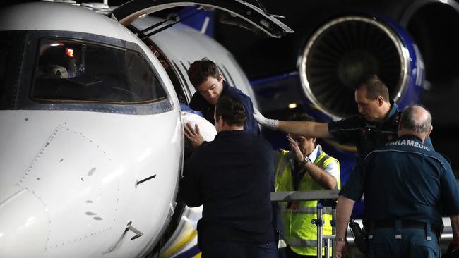 Injured workers from an explosion at Grosvenor coal mine at Moranbah arriving in Brisbane. Picture: Josh Woning/AAP