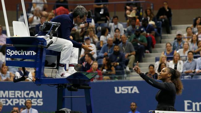 TOPSHOT - Serena Williams of the US argues with chair umpire Carlos Ramos while playing Naomi Osaka of Japan during their 2018 US Open women's singles final match on September 8, 2018 in New York. - Osaka, 20, triumphed 6-2, 6-4 in the match marred by Williams's second set outburst, the American enraged by umpire Carlos Ramos's warning for receiving coaching from her box. She tearfully accused him of being a "thief" and demanded an apology from the official. (Photo by Eduardo MUNOZ ALVAREZ / AFP)