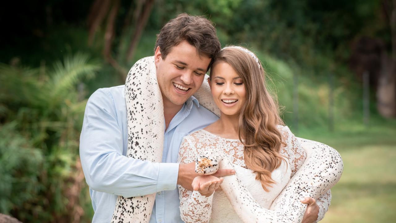 Chandler Powell and Bindi Irwin on their wedding day with a python. Picture Kate Berry