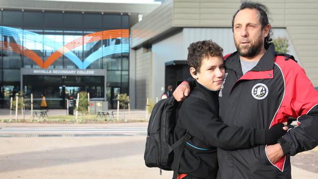 David Hansen and his son Tyree, 12, arrive at the school Thursday morning. Picture: Dean Martin