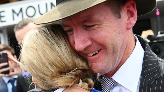 Jamie Kah and Ciaron Maher hug after Another Wil wins The Damien Oliver on Derby Day at Flemington Picture: Vince Caligiuri/Getty Images