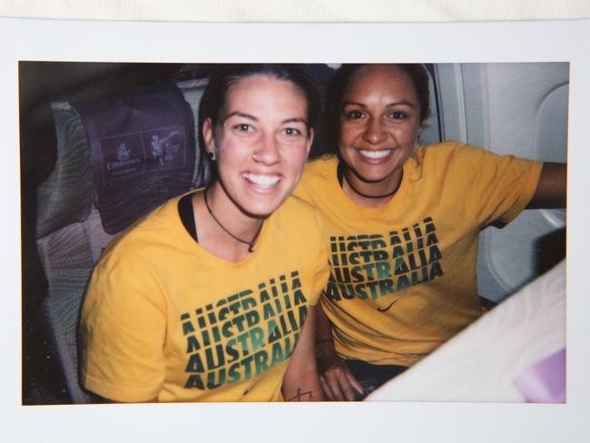 Photo with teammate Alanna Kennedy: We were on a plane going to a tour and the flight attendant was going around taking Polaroids.