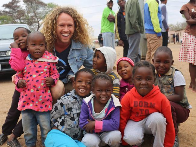 Important trip ... Reality star Tim Dormer in Botswana with Hero Condoms to raise awareness of their donation scheme. Picture: Supplied