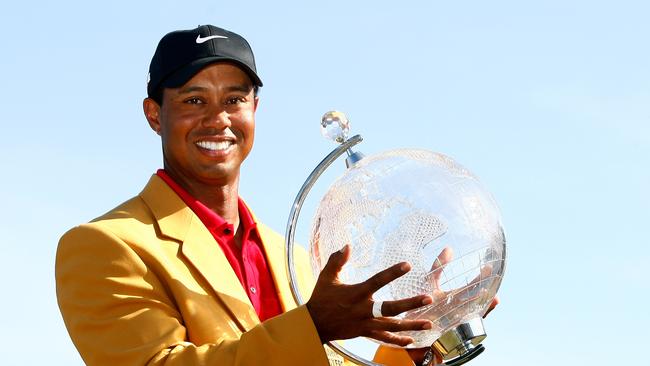 Tiger Woods holds the 2009 Australian Masters trophy after winning at Kingston Heath Golf Club. Photo: Quinn Rooney/Getty Images