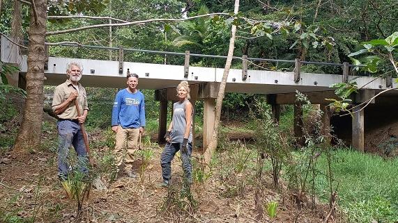 Peter Rowles with Ian and Sue Shankly from C4- Community for Coastal and Cassowary Conservation replacing weeds with cassowary-friendly shrubs to create a safer road crossing spot at the Wongaling Creek site. Picture: Supplied