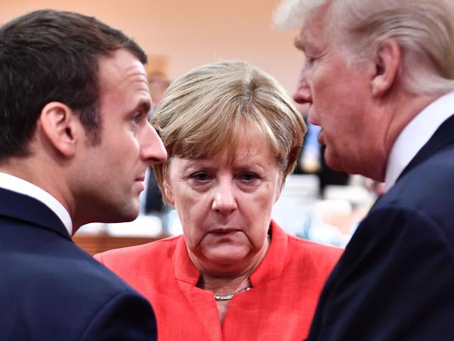 Donald Trump is at odds with French President Emmanuel Macron and German Chancellor Angela Merkel. Picture: AFP