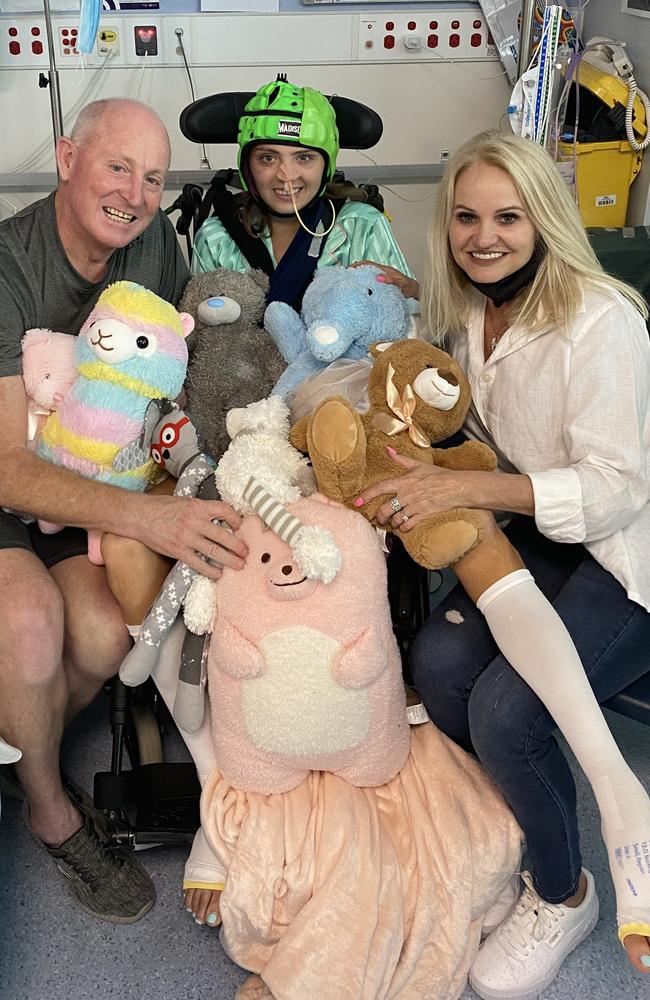 Triathlete Alexa Leary (middle) with parents Russell (left) and Belinda (right) celebrating her 20th birthday from the Royal Brisbane and Women's Hospital.