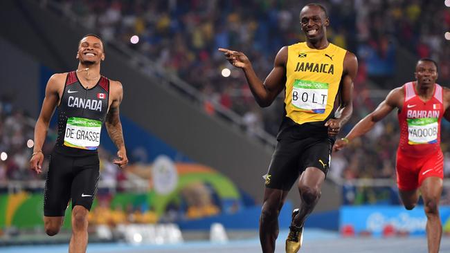 Usain Bolt jokes with Andre De Grasse at the Rio Olympics. Picture: AFP Photo