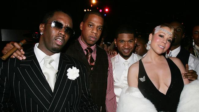 Sean Combs, Jay-Z, Usher, and Mariah Carey at the 26th Birthday party for Usher October 17, 2004 at the Rainbow Room in New York City. The party theme was dress and decor of the 1920s. (Photo by Frank Micelotta/Getty Images)