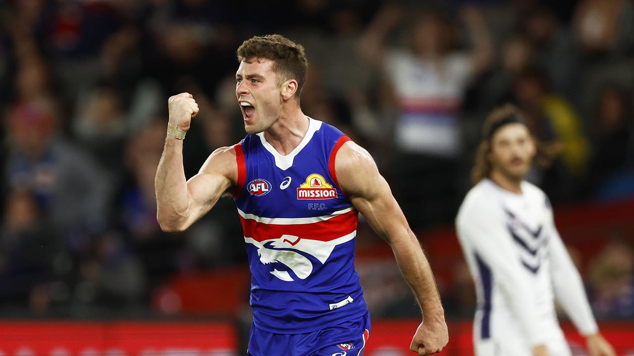 Josh Dunkley of the Bulldogs celebrates kicking a goal during the round 21 AFL match between the Western Bulldogs and the Fremantle Dockers at Marvel Stadium.