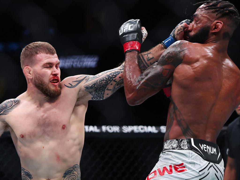 NEWARK, NEW JERSEY - JUNE 01: (L-R) Jake Matthews of Australia and Phil Rowe exchange strikes in their welterweight bout during UFC 302 at Prudential Center on June 01, 2024 in Newark, New Jersey. Luke Hales/Getty Images/AFP (Photo by Luke Hales / GETTY IMAGES NORTH AMERICA / Getty Images via AFP)