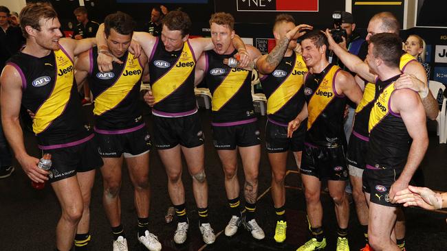 Richmond players sing the team song after their win over Collingwood. Picture: AAP