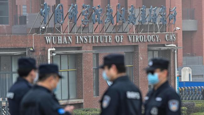 Security personnel stand guard outside the Wuhan Institute of Virology as members of the World Health Organisation (WHO) team investigating the origins of the COVID-19 coronavirus make a visit. Picture: Hector Retamal/AFP