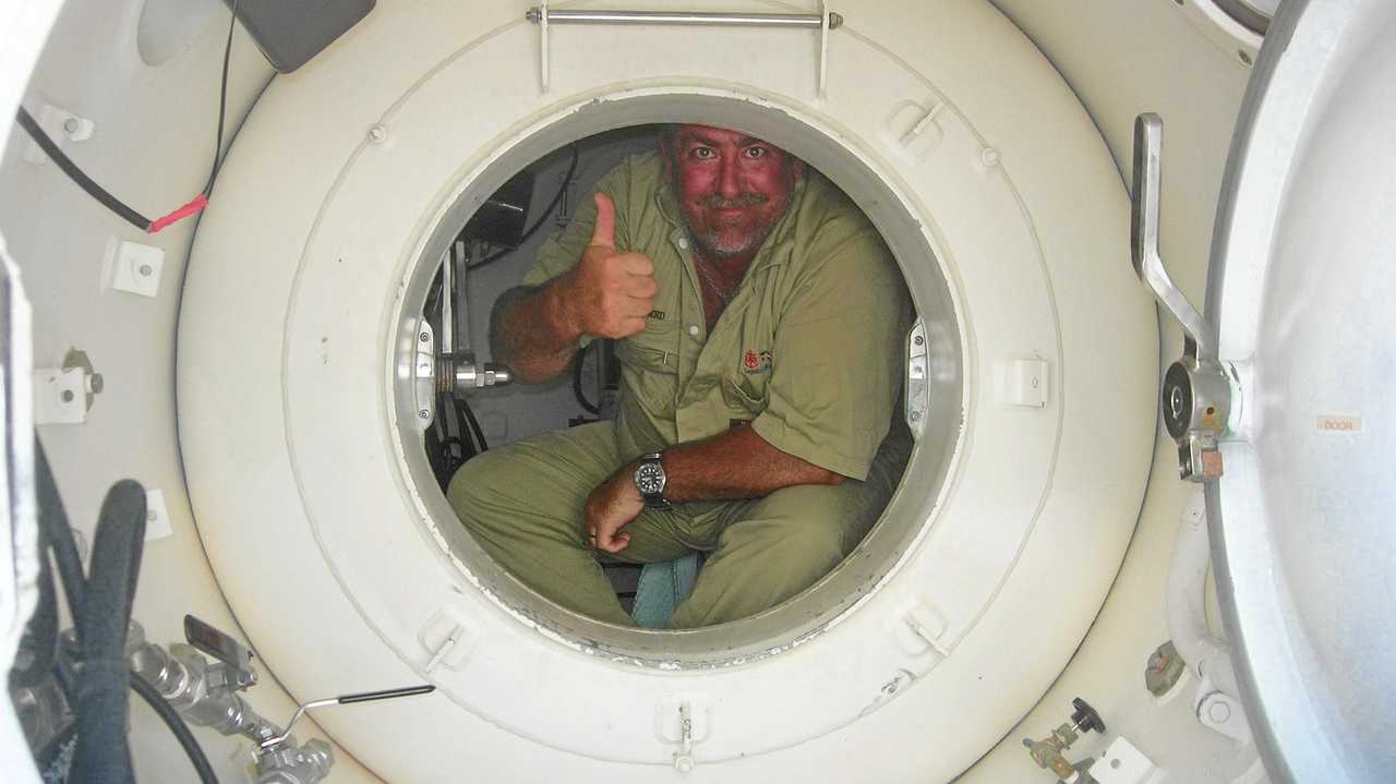 THE POT: Rainbow Beach diver Kevin Phillips in "the pot," one of Queensland's few decompression chambers, where divers with the bends sometimes have to spend 48 hours or so. It is a place most divers hope to avoid. Picture: Contributed