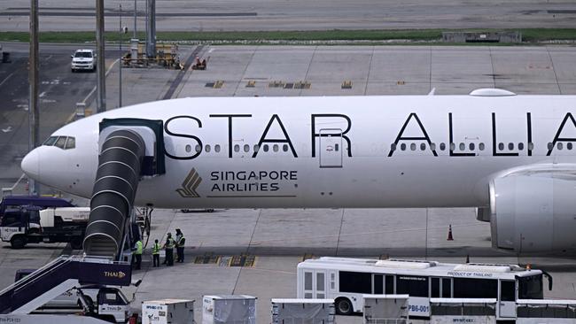 The Singapore Airlines flight SQ321, which was headed to Singapore from London before making an emergency landing in Bangkok due to severe turbulence, is seen on the tarmac at the Suvarnabhumi International Airport in Bangkok. (Photo by Lillian SUWANRUMPHA / AFP)