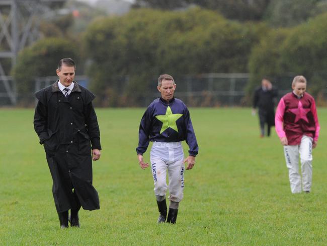 Van Gestel walks inspects a track surface with jockey Glynn Schofield during his first day in the top job.