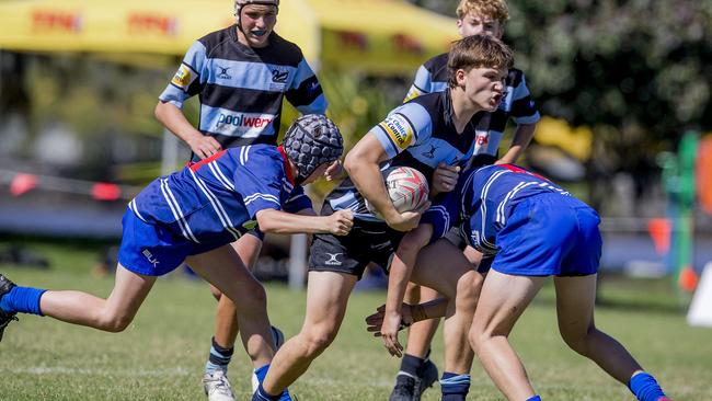 Day One of King of the Country rugby tournament at James Overell Park, Southport. Maroochydore Swans U14s' ( big stripes - blue) in action against USQ Saints U14s' (darker blue small stripes). Maroochydore Swans U14s Zac Heath . Picture: Jerad Williams