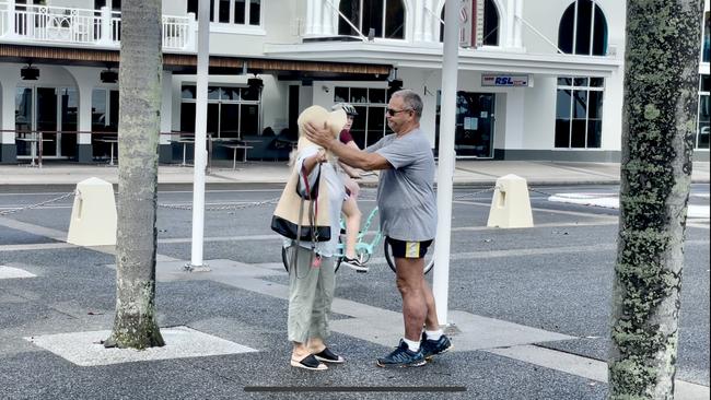 The woman speaks with a man after the health minister’s exit. Picture: Chris Calcino