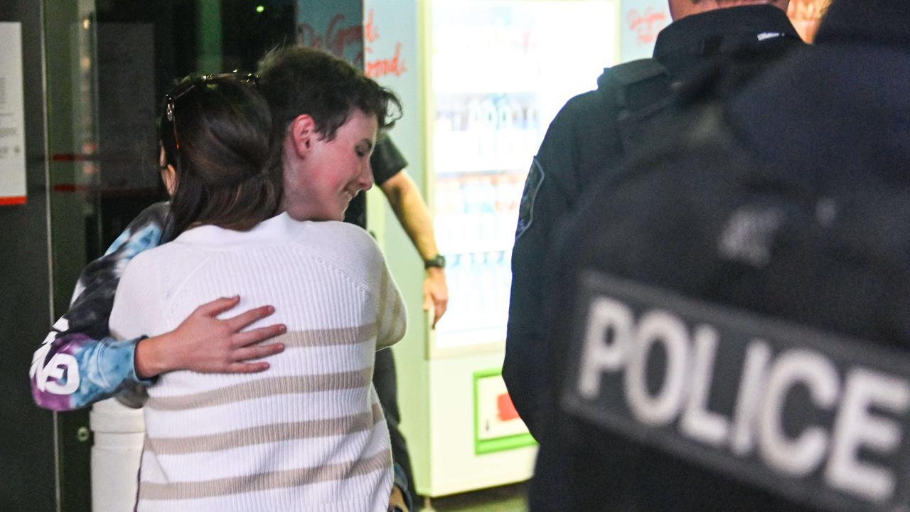Tania Reckwell greets her son Zac after he was locked down in the Westfield Marion. Picture: NewsWire / Brenton Edwards